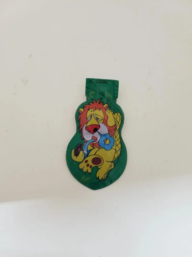 Vintage-Style Tin Lion Toy – Green Clicker Collectible Figurine 1